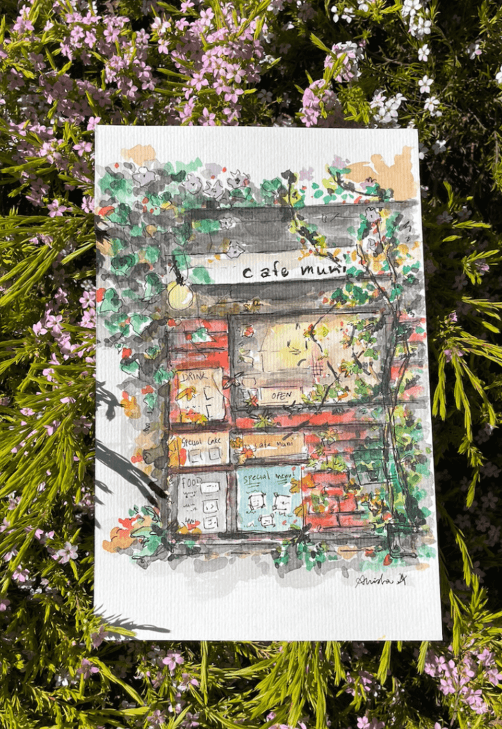 Watercolor illustration of Cafe Muni surrounded by greenery and flowers.