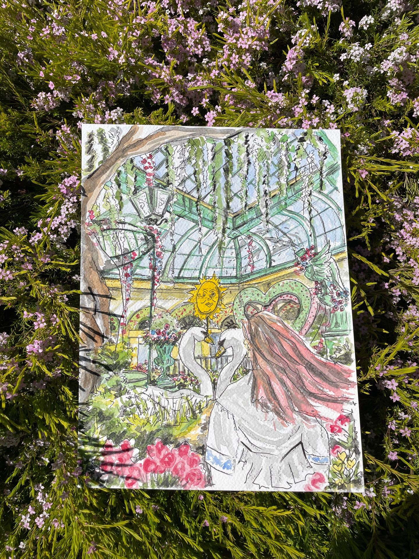 Colorful drawing of a greenhouse garden scene over a bed of small pink flowers and green foliage.